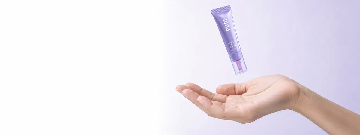 Playful commercial product photograph for a very wide 27:10 bento stat cell. The exact small PURE Ey